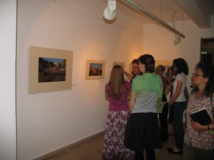 Guests venture out into the exhibition space to see photographs taken by Claudia Wiens.