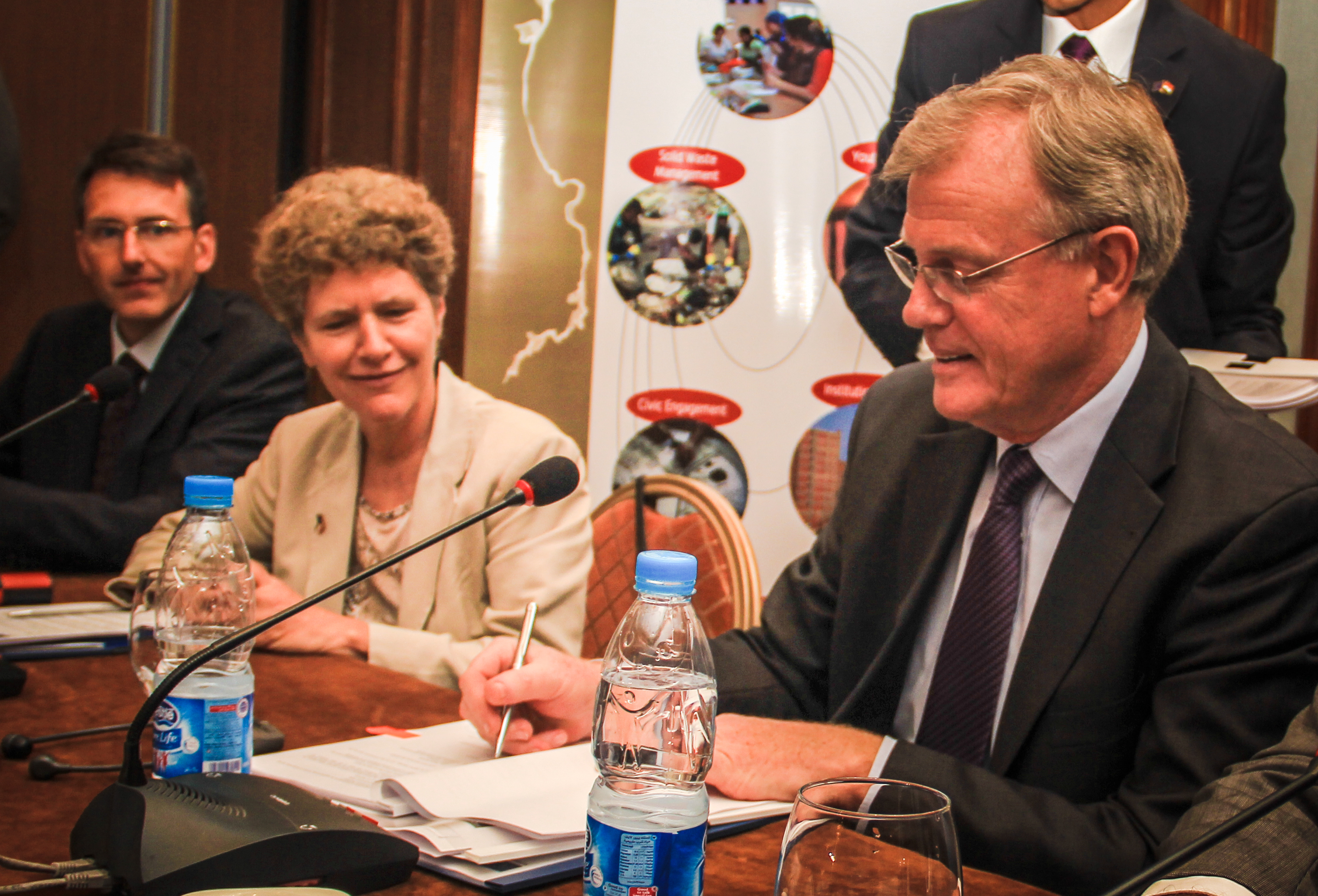 EU Ambassador James Moran with Maria Schäfer (GIZ) signing the cooperation agreement